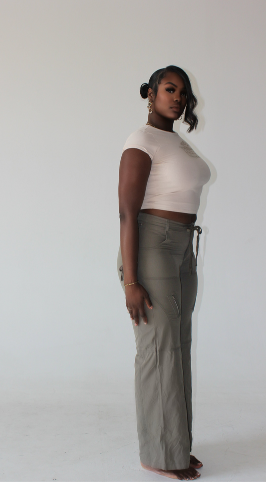 tall model styled in graphic cropped top and high-waisted cargo pants with tie detail – tall women’s streetwear