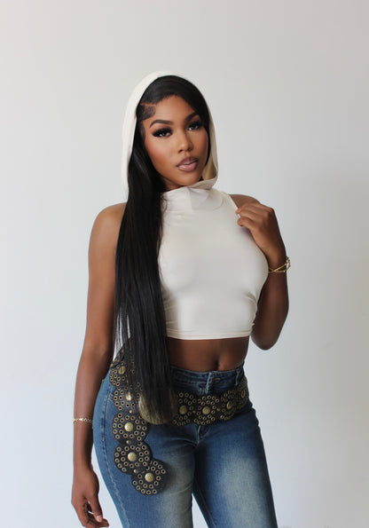Tall woman wearing sleeveless tan hoodie crop top – front view