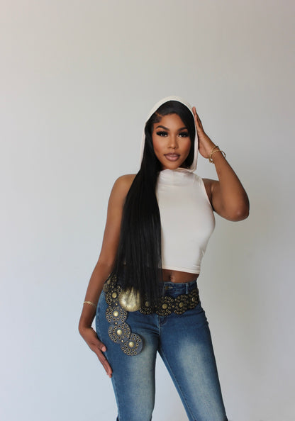 Tall woman in motion wearing gray hooded crop tank – active luxury streetwear
