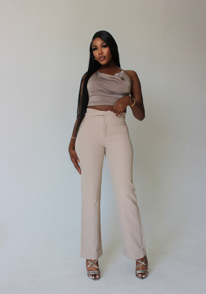 tall fashion model styled in beige asymmetrical pants and satin top – modern corporate streetwear