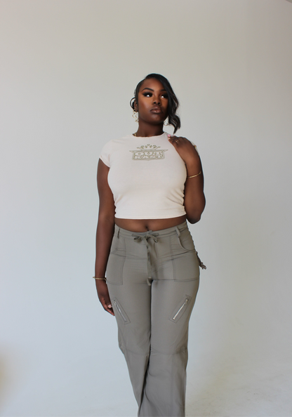 tall model styled in graphic cropped top and high-waisted cargo pants with tie detail – tall women’s streetwear