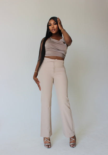 tall fashion model styled in beige asymmetrical pants and satin top – modern corporate streetwear