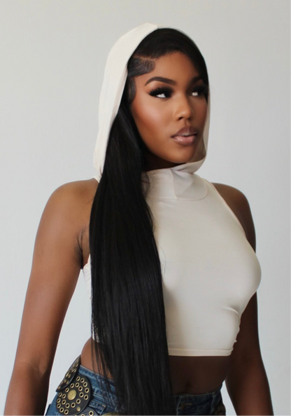 Side profile of tall model in cropped hooded tank top with open back
