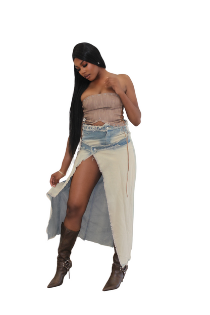 side profile of tall model in high-waisted denim skirt with wrap design and front slit